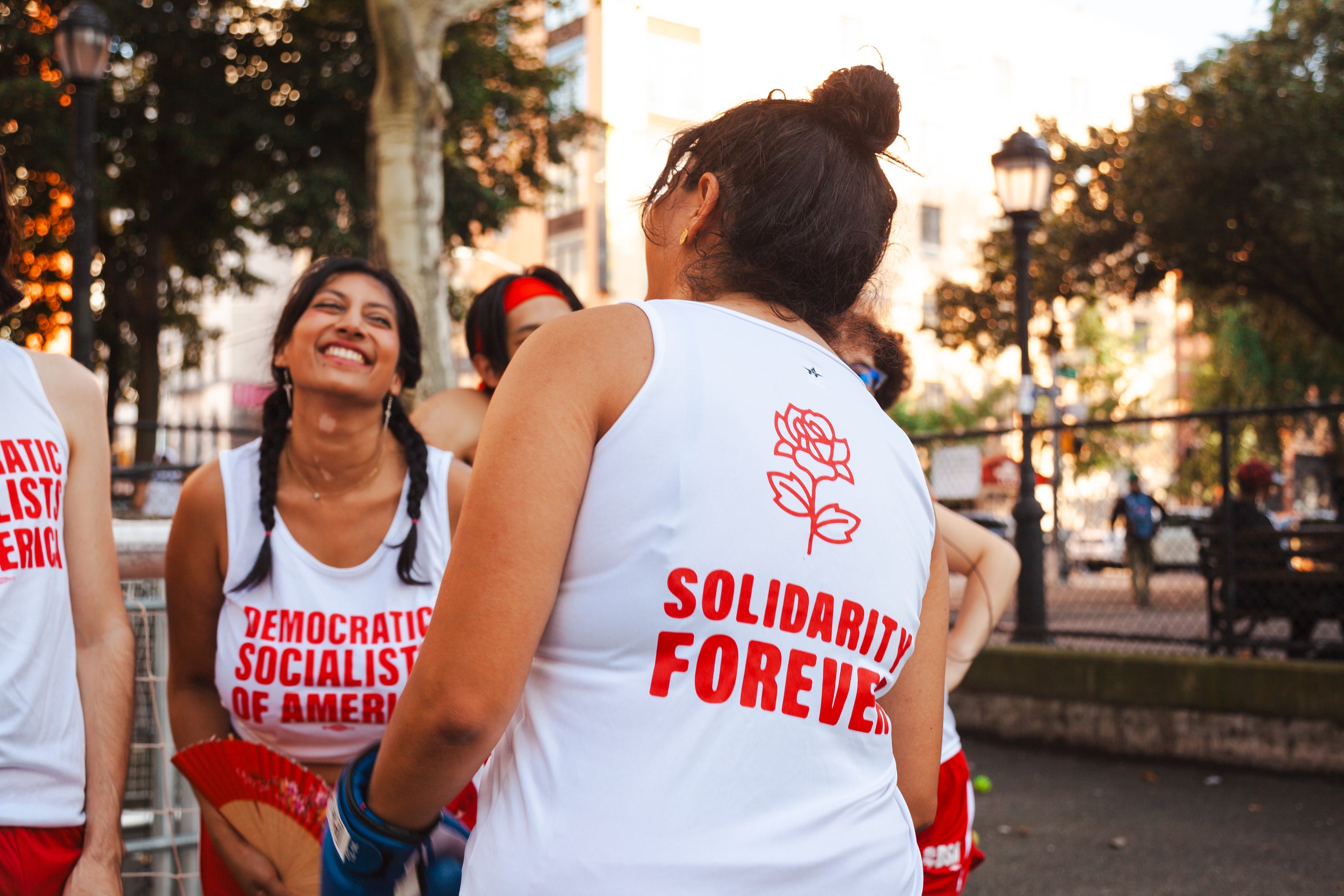 A group of socialists in track uniforms in a public park